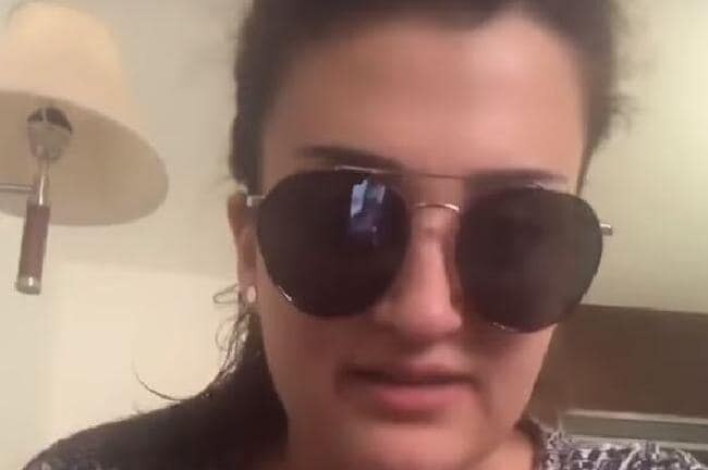 A screenshot of Mona el-Mazboh wearing sunglasses in an apology video.
