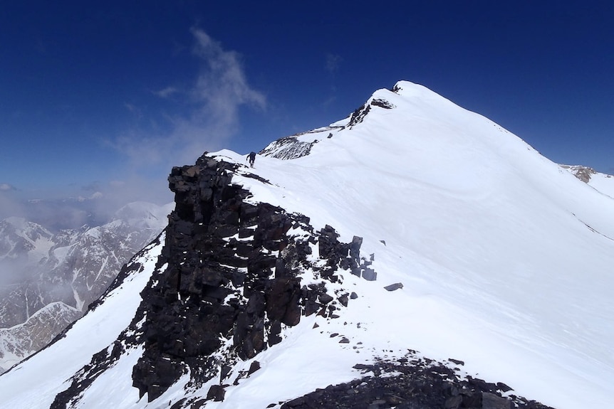 A climber pushes toward the summit of Afghanistan's highest peak
