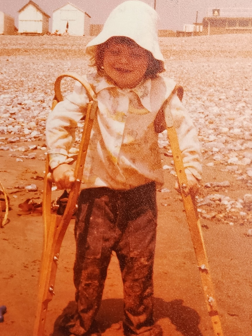 A child using crutches.