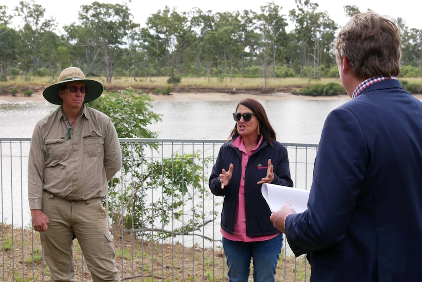 Farmers discussing court action next to the Burnett River