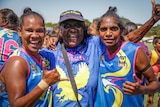 Grandmother Lilly Rogers and her two granchildren after the first women's West Kimberley Football League grand final
