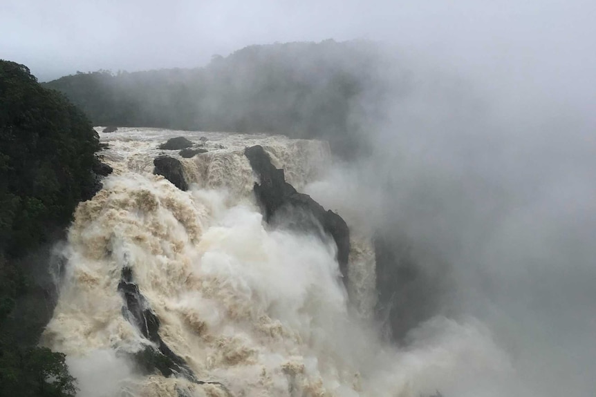 Water pours over Barron Falls.