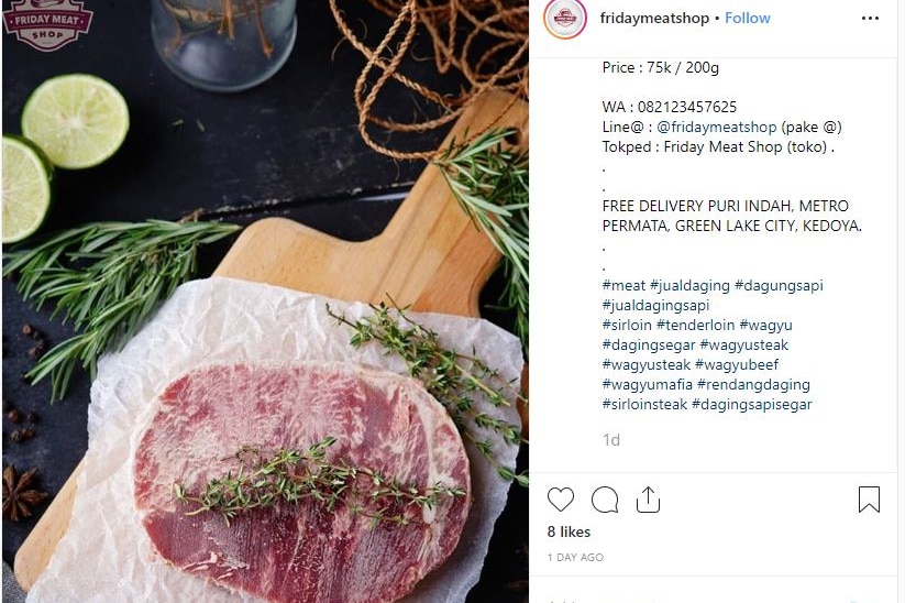 Photo of piece of meat on a board with words beside it, touting it for sale
