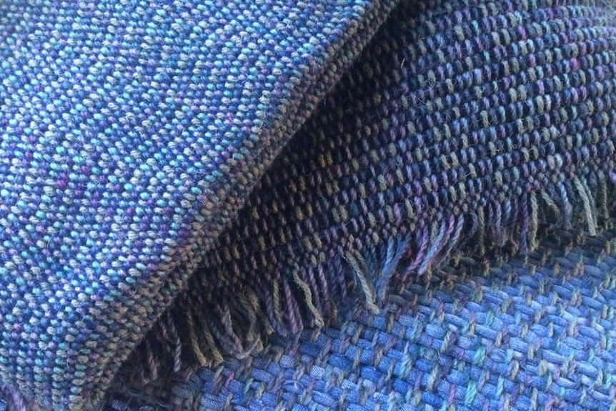 A close-up of woven denim floor rugs.
