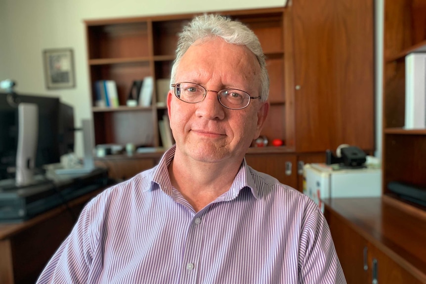 Information Commissioner Peter Shoyer sits in an office.