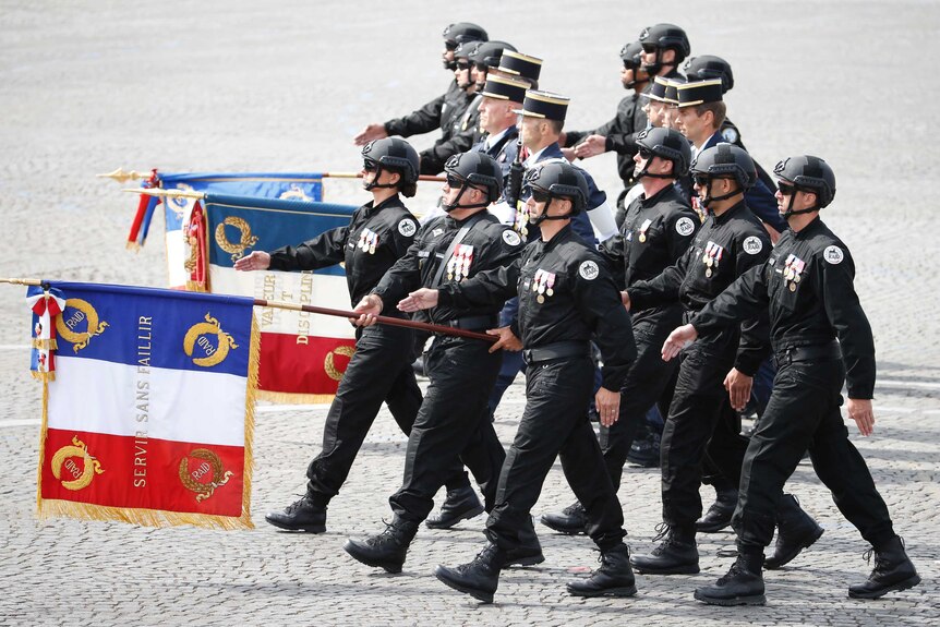 Members of the RAID march down the Champs Elysees during the annual Bastille Day military parade