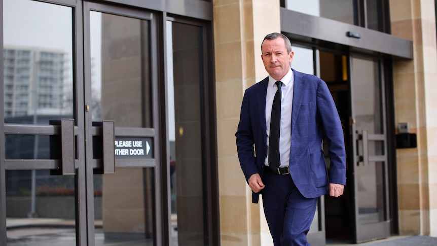 WA premier Mark McGowan wearing a suit and tie outside parliament