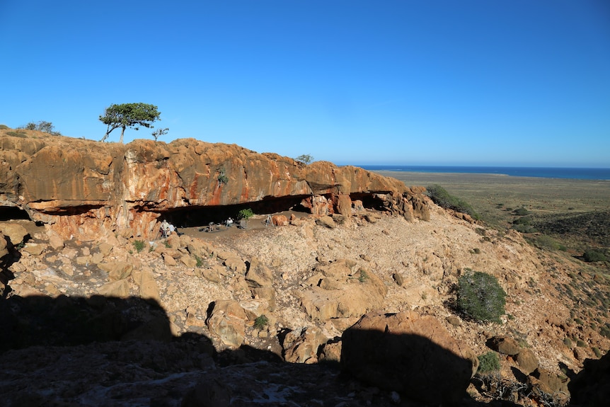 Wide view of a four people in a cave 