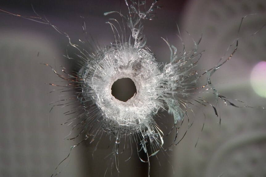 Bullet hole in glass window
