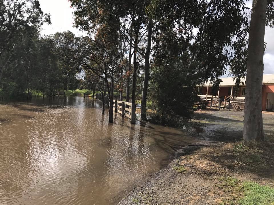Large puddle of water near a house at Kialla, Victoria