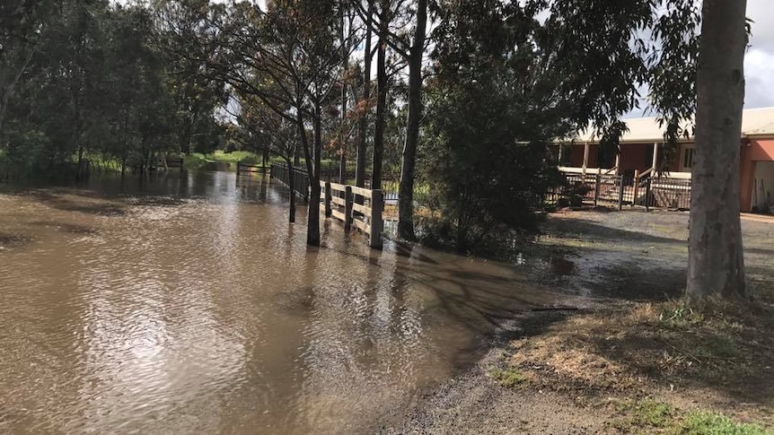 Large puddle of water near a house at Kialla, Victoria