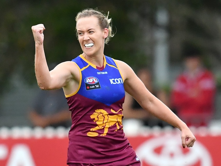 Lauren Arnell celebrates kicking a goal with her fist in the air