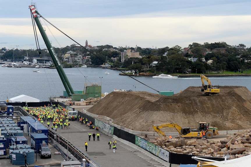 Construction workers at the Barangaroo development in Sydney assemble after a security scare on the site.
