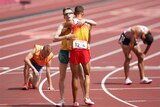 An Australian Paralympic runner hugs the Spanish athlete who beat him in the 5,000m T13 in Tokyo.