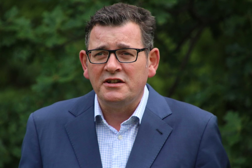 A picture of Victorian Premier Daniel Andrews holding an outdoor press conference.