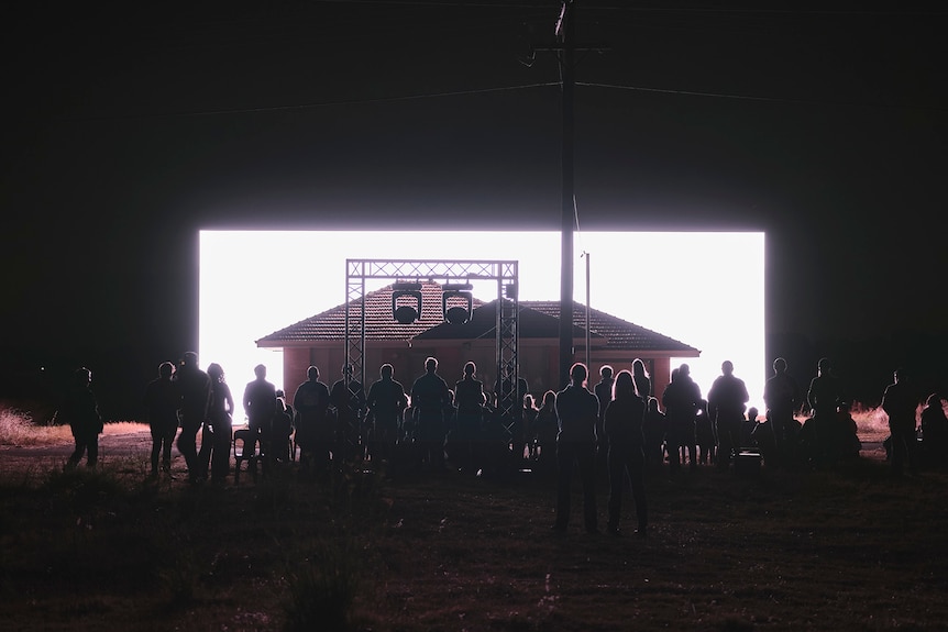 40 people watch a show about 20 Dalison Street in the dark