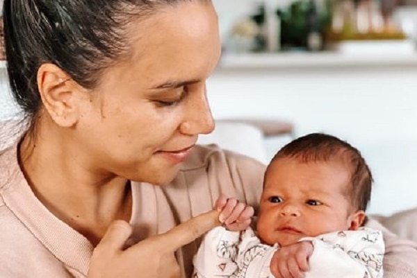 Mary Thomas holds her newborn daughter Polly.