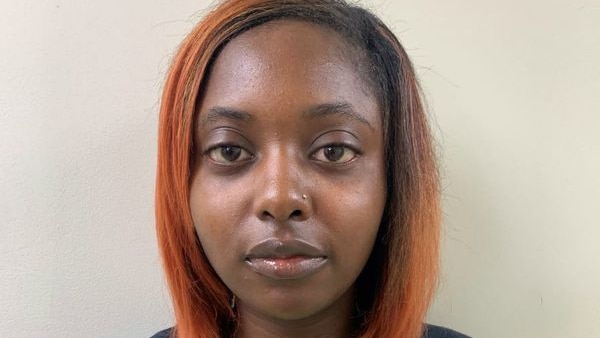Headshot of Marshae Jones, a young African American woman with orange hair and wearing a black T-shirt.