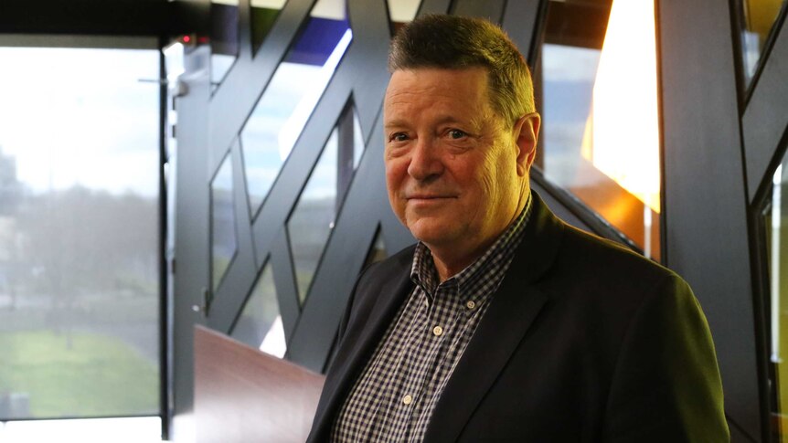 Mayor of Brimbank City Council John Hedditch looks at the camera, from inside the council's chamber buildings