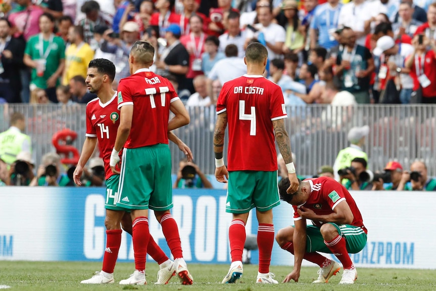 Morocco players look to ground after elimination from World Cup