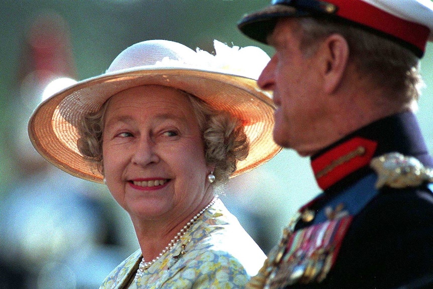 Queen Elizabeth II gazes with a smile at her husband Prince Philip.