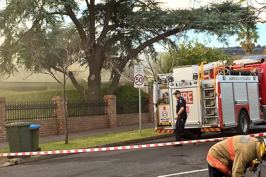 Firefighters outside the scene of the fatal Netherby fire