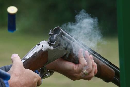 A shell is ejected after a shotgun is fired.