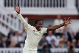 Jofra Archer raises his hands and shouts with joy.