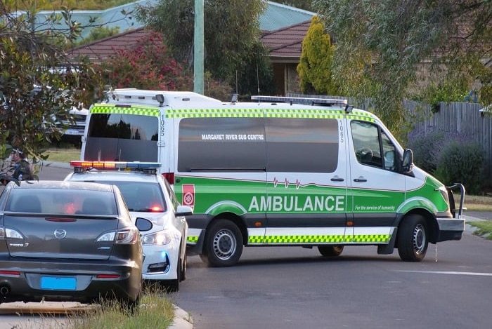 An ambulance parked outside a house in Margaret River during a stand-off.