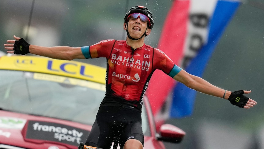 Belgium's Dylan Teuns celebrates as he crosses the finish line to win the eighth stage of the Tour de France
