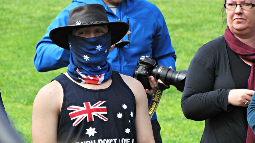 Protester wearing face mask at Melton rally