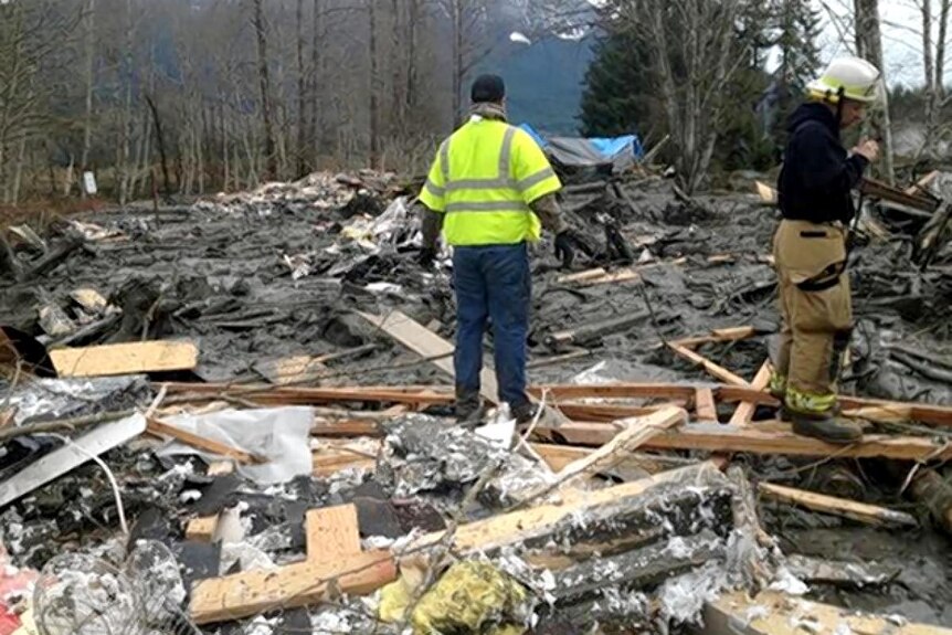 Emergency services personnel work at the site of a mudslide near the town of Oso in Washington State.