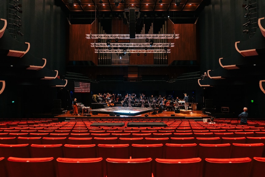 An extreme wide shot of inside a concert hall.