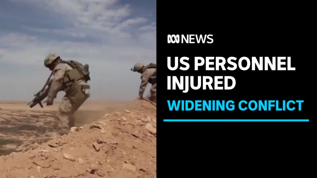 US Personnel Injured, Widening Conflict: Troops in military fatigues scrambling over a sand dune.