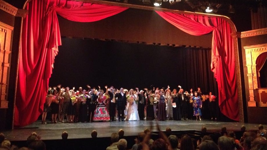 Cast of Cairns Choral Society's production of The Phantom of the Opera receives a standing ovation as they wave a final goodbye.