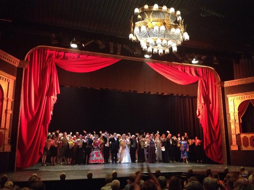 Cast of Cairns Choral Society's production of The Phantom of the Opera receives a standing ovation as they wave a final goodbye.