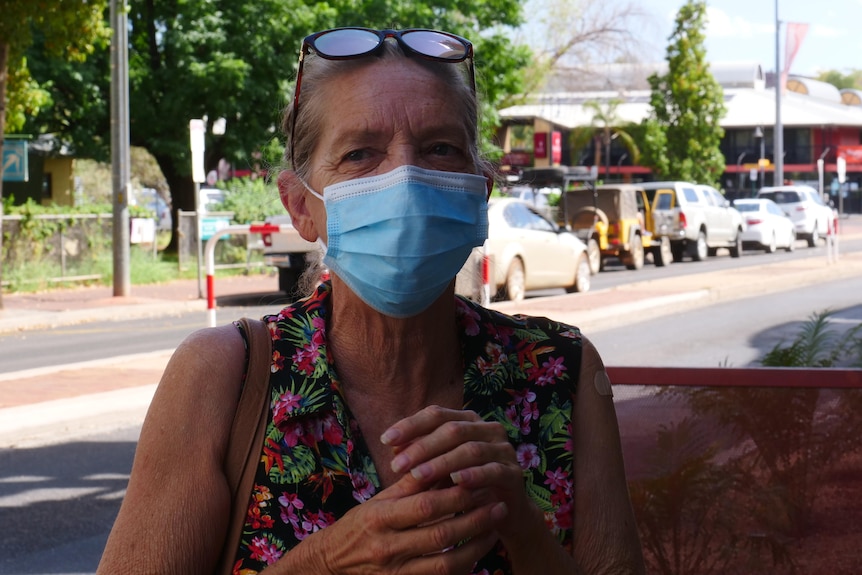 A woman wearing a face mask in the Alice Springs CBD.