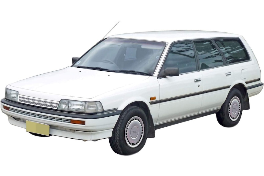 A close-up shot of a white 1992 Toyota Camry Station Wagon with its number plate blurred.