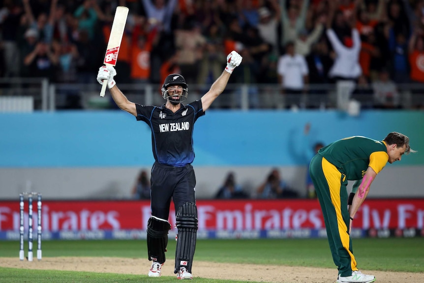 New Zealand's Grant Elliott celebrates hitting the winning runs against South Africa.