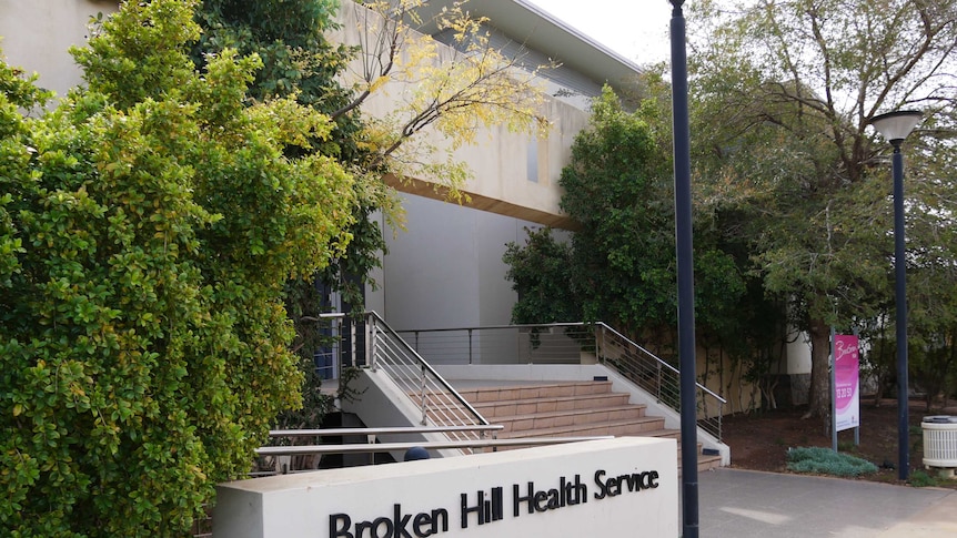 A shot from the footpath of stairs leading to an entry and a sign reading Broken Hill Health Service.