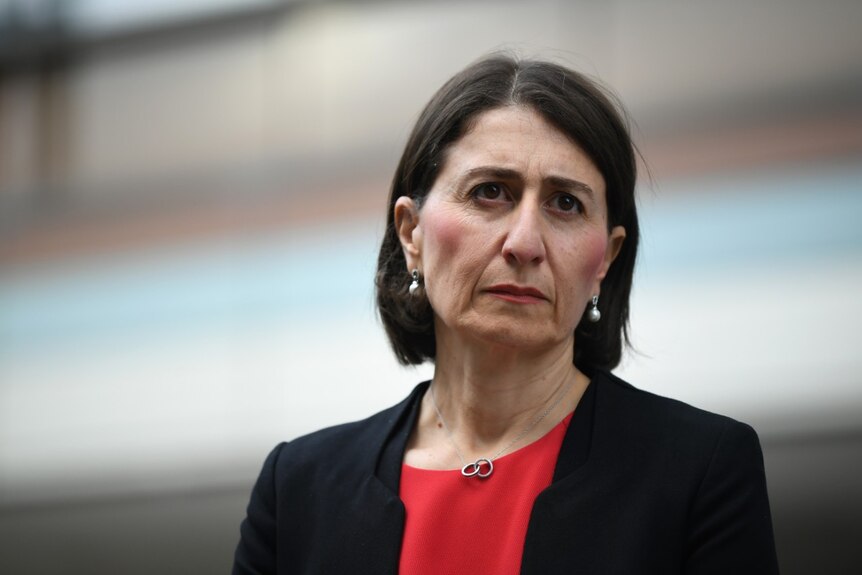Gladys Berejiklian looking serious during a press conference.