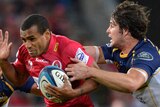 No way through ... the Reds' Will Genia tries his luck against the relentless Brumbies defence.