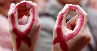 340x180 custom image of AIDS symbol on hands