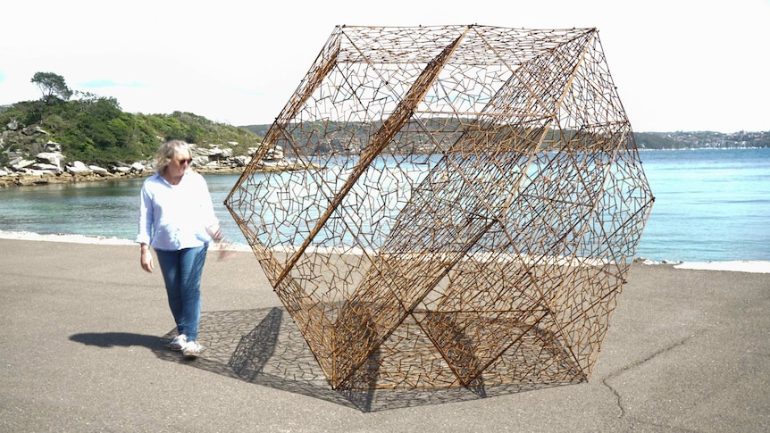 Simon Hodgson's artwork which features a a triangular structure placed on a wharf area