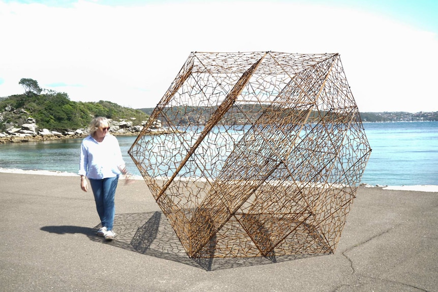 Simon Hodgson's artwork which features a a triangular structure placed on a wharf area