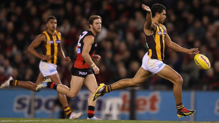 Hawthorn's Cyril Rioli kicks a goal against Essendon at Docklands in July 2013.