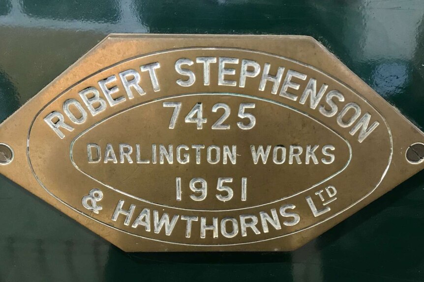A plaque on the side of a train that reads "Robert Stephenson 7425 Darlington Works 1951 & Hawthorns Ltd".