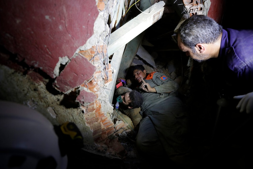 Lebanese soldiers search for survivors after a massive explosion in Beirut, Lebanon.
