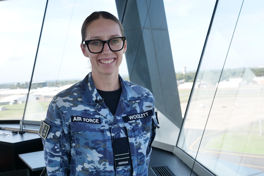 Woman from shoulders up in airforce uniform.