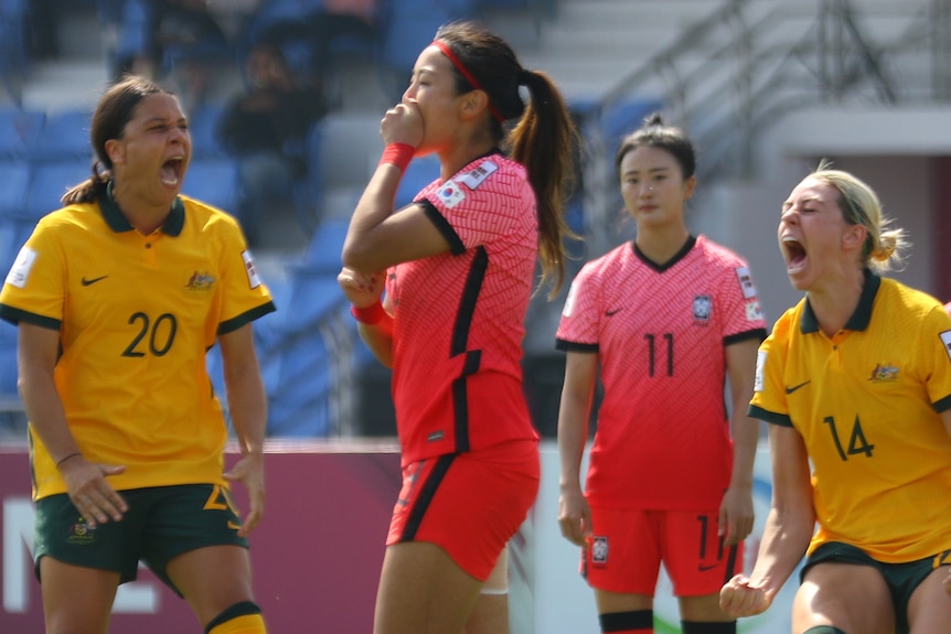 South Korea's Cho So Hyon reacts after missing a penalty kick while Sam Kerr and Alanna Kennedy celebrate 